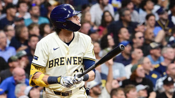 Aug 12, 2025; Milwaukee, Wisconsin, USA; Milwaukee Brewers designated hitter Christian Yelich (22) hits a 2-run home run in the fifth inning against the Pittsburgh Pirates at American Family Field. Mandatory Credit: Benny Sieu-Imagn Images
