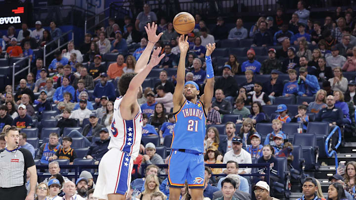 Mar 19, 2025; Oklahoma City, Oklahoma, USA; Oklahoma City Thunder guard Aaron Wiggins (21) shoots a three point basket against the Philadelphia 76ers during the second half at Paycom Center. Mandatory Credit: Alonzo Adams-Imagn Images