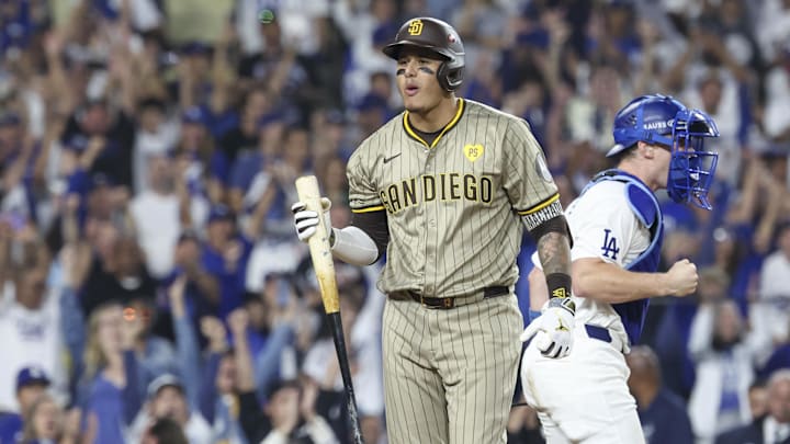 Oct 5, 2024; Los Angeles, California, USA; San Diego Padres third baseman Manny Machado (13) strikes out in the ninth inning against the Los Angeles Dodgers during game one of the NLDS for the 2024 MLB Playoffs at Dodger Stadium. Mandatory Credit: Kiyoshi Mio-Imagn Images Oct 5, 2024; Los Angeles, California, USA; San Diego Padres third baseman Manny Machado (13) strikes out in the ninth inning against the Los Angeles Dodgers during game one of the NLDS for the 2024 MLB Playoffs at Dodger Stadium. Mandatory Credit: Kiyoshi Mio-Imagn Images