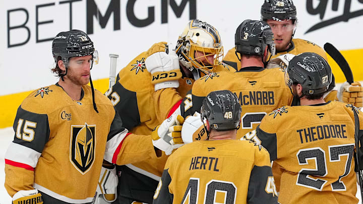 Apr 10, 2025; Las Vegas, Nevada, USA; Vegas Golden Knights goaltender Adin Hill (33) celebrates with team mates after defeating the Seattle Kraken 2-1 at T-Mobile Arena. Mandatory Credit: Stephen R. Sylvanie-Imagn Images