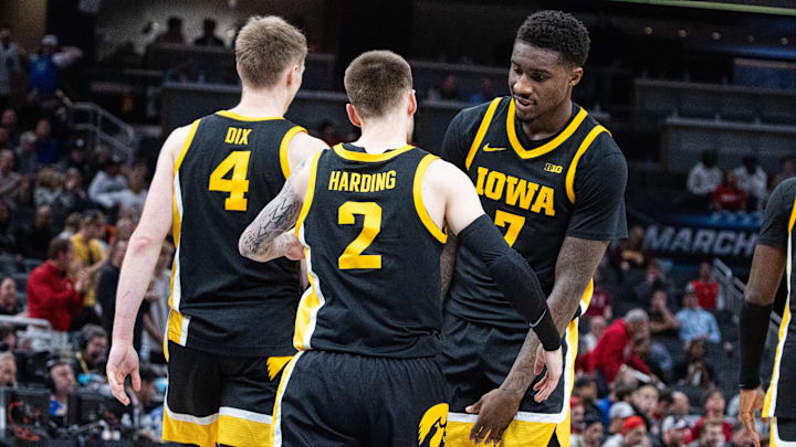 Mar 12, 2025; Indianapolis, IN, USA; Iowa Hawkeyes guard Brock Harding (2) celebrates with teammates after hitting the game winning 3 point shot in the second half against the Ohio State Buckeyes  at Gainbridge Fieldhouse. Mandatory Credit: Trevor Ruszkowski-Imagn Images
