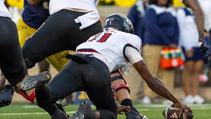 Oct 11, 2025; South Bend, Indiana, USA; NC State Wolfpack quarterback CJ Bailey (11) fumbles a snap in the end zone for a safety against the Notre Dame Fighting Irish during the second half at Notre Dame Stadium. Mandatory Credit: Michael Caterina-Imagn Images Oct 11, 2025; South Bend, Indiana, USA; NC State Wolfpack quarterback CJ Bailey (11) fumbles a snap in the end zone for a safety against the Notre Dame Fighting Irish during the second half at Notre Dame Stadium. Mandatory Credit: Michael Caterina-Imagn Images