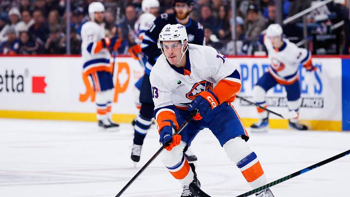 Jan 13, 2026; Winnipeg, Manitoba, CAN; New York Islanders forward Mathew Barzal (13) skates into the Winnipeg Jets zone during the first period at Canada Life Centre. Mandatory Credit: Terrence Lee-Imagn Images