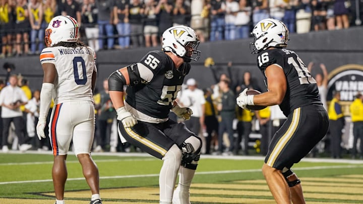 Vanderbilt tight end Cole Spence (16) celebrates his touchdown with offensive lineman Bryce Henderson (55) during overtime at FirstBank Stadium in Nashville, Tenn., Saturday, Nov. 8, 2025. Vanderbilt tight end Cole Spence (16) celebrates his touchdown with offensive lineman Bryce Henderson (55) during overtime at FirstBank Stadium in Nashville, Tenn., Saturday, Nov. 8, 2025.