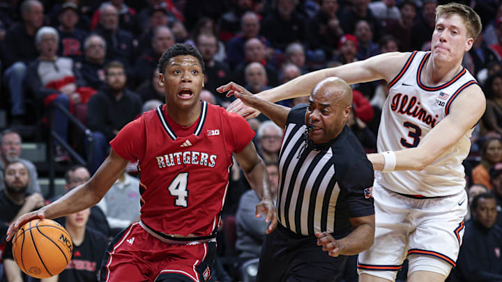 Rutgers guard Ace Bailey (4) goes to the basket in front of Illinois forward Ben Humrichous (3) and a referee Rutgers guard Ace Bailey (4) goes to the basket in front of Illinois forward Ben Humrichous (3) and a referee