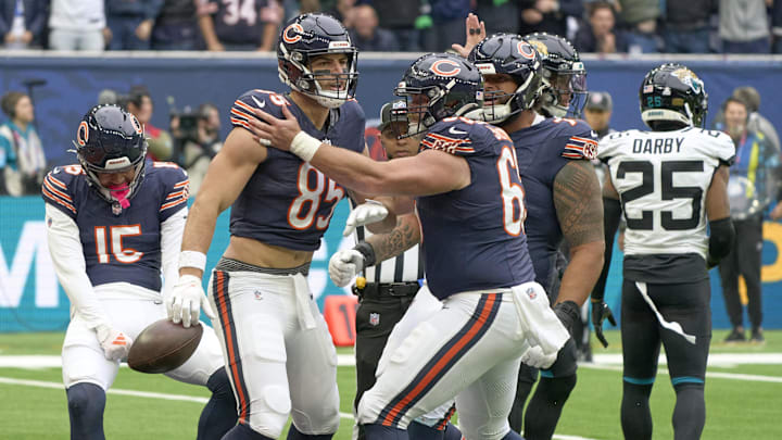 Oct 13, 2024; London, United Kingdom;  Chicago Bears tight end Cole Kmet (85)  celebrates scoring a touchdown with teammates during an NFL International Series game at Tottenham Hotspur Stadium. Mandatory Credit: Peter van den Berg-Imagn Images