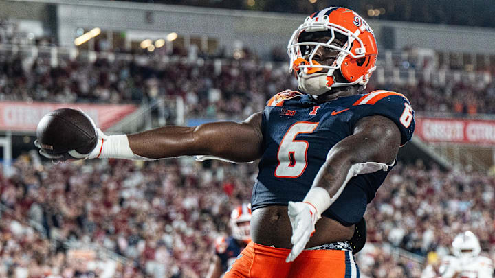 Dec 31, 2024; Orlando, FL, USA; Illinois Fighting Illini running back Josh McCray (6) celebrates his touchdown against the South Carolina Gamecocks in the fourth quarter at Camping World Stadium. Mandatory Credit: Jeremy Reper-Imagn Images