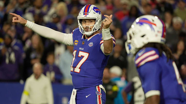 Buffalo Bills quarterback Josh Allen signals to running back James Cook during first half action against the Baltimore Ravens at Highmark Stadium in Orchard Park on Sept. 7, 2025.