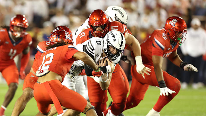 Sep 27, 2025; Ames, Iowa, USA; Iowa State Cyclones quarterback Connor Moberly (5) runs for a first down against the Arizona Wildcats during the second half at Jack Trice Stadium. Mandatory Credit: Reese Strickland-Imagn Images
