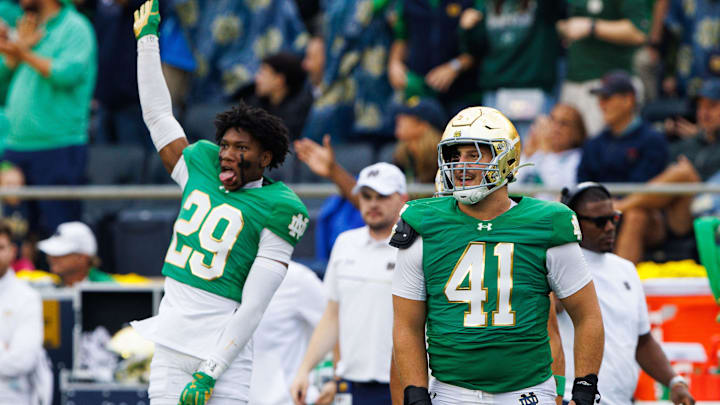 Notre Dame defensive lineman Donovan Hinish (41) and cornerback Christian Gray (29) celebrate Louisville coming up short on a fourth down during a NCAA college football game between Notre Dame and Louisville at Notre Dame Stadium on Saturday, Sept. 28, 2024, in South Bend.