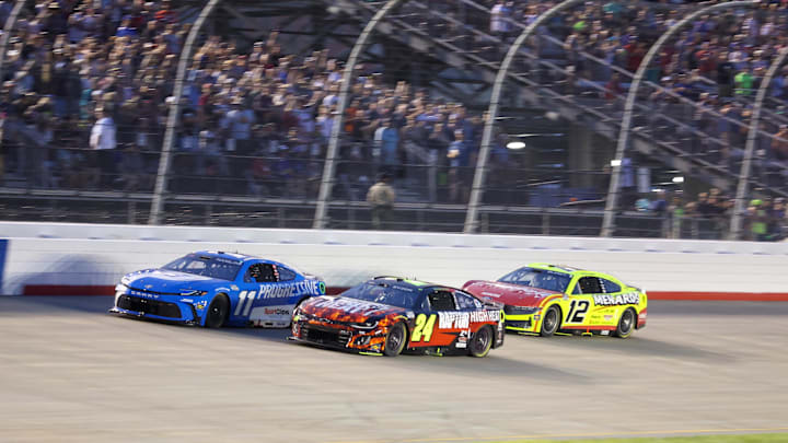 Jun 1, 2025; Lebanon, Tennessee, USA; NASCAR Cup Series driver Denny Hamlin (11) leads driver William Byron (24) and driver Ryan Blaney (12) during the Cracker Barrel 400 at Nashville Superspeedway.