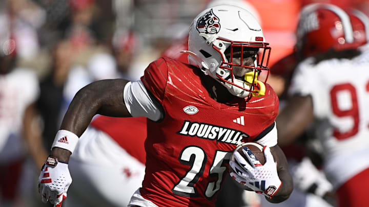 Sep 7, 2024; Louisville, Kentucky, USA;  Louisville Cardinals running back Isaac Brown (25) runs the ball against the Jacksonville State Gamecocks during the second half at L&N Federal Credit Union Stadium. Louisville defeated Jacksonville State 49-14. 