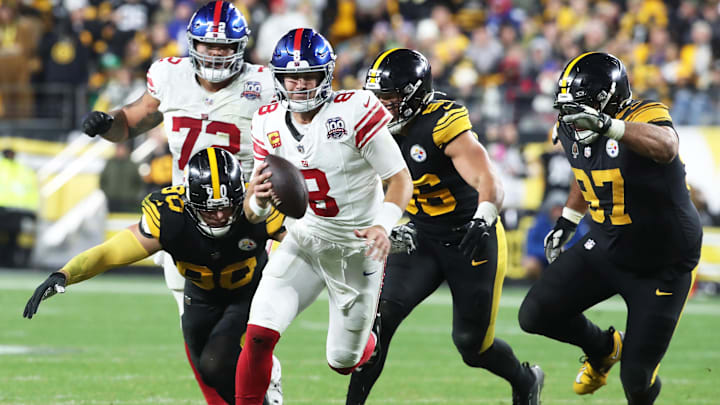 Oct 28, 2024; Pittsburgh, Pennsylvania, USA;  New York Giants quarterback Daniel Jones (8) runs the ball against the Pittsburgh Steelers during the fourth quarter at Acrisure Stadium.  