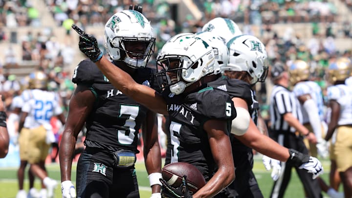 Aug 31, 2024; Honolulu, Hawaii, USA; Hawaii Rainbow Warriors wide receiver Pofele Ashlock (5) reacts after he made a first-quarter touchdown against the UCLA Bruins during an NCAA college football game at the Clarence T.C. Ching Athletics Complex. Aug 31, 2024; Honolulu, Hawaii, USA; Hawaii Rainbow Warriors wide receiver Pofele Ashlock (5) reacts after he made a first-quarter touchdown against the UCLA Bruins during an NCAA college football game at the Clarence T.C. Ching Athletics Complex.
