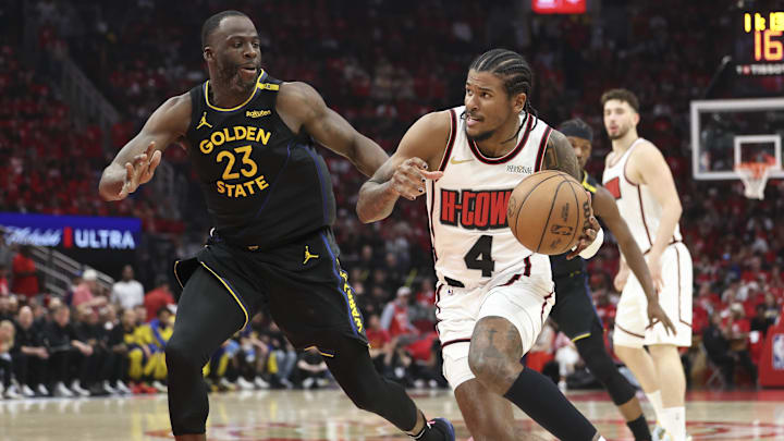 May 4, 2025; Houston, Texas, USA; Houston Rockets guard Jalen Green (4) drives with the ball as Golden State Warriors forward Draymond Green (23) defends during game seven of the first round for the 2025 NBA Playoffs at Toyota Center. Mandatory Credit: Troy Taormina-Imagn Images