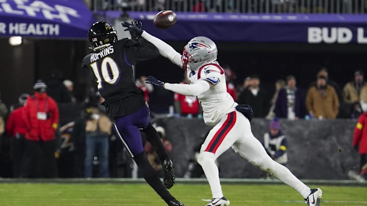 Dec 21, 2025; Baltimore, Maryland, USA;  Baltimore Ravens wide receiver Deandre Hopkins (10) makes a catch against New England Patriots cornerback Carlton Davis III (7) during the second half of the game at M&T Bank Stadium. Mandatory Credit: James Lang-Imagn Images