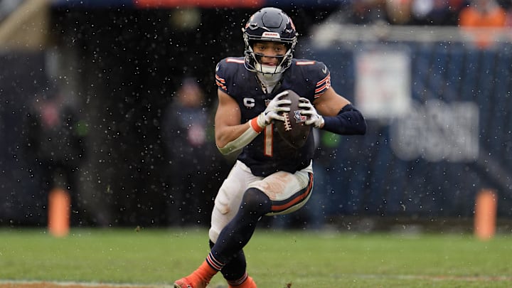 Dec 31, 2023; Chicago, Illinois, USA;  Chicago Bears quarterback Justin Fields (1) runs with the