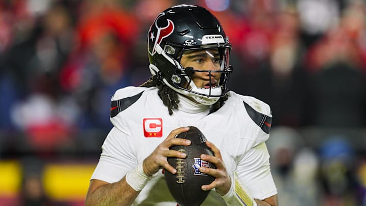 Jan 18, 2025; Kansas City, Missouri, USA; Houston Texans quarterback C.J. Stroud (7) drops back to pass during the second half against the Kansas City Chiefs in a 2025 AFC divisional round game at GEHA Field at Arrowhead Stadium. Mandatory Credit: Jay Biggerstaff-Imagn Images