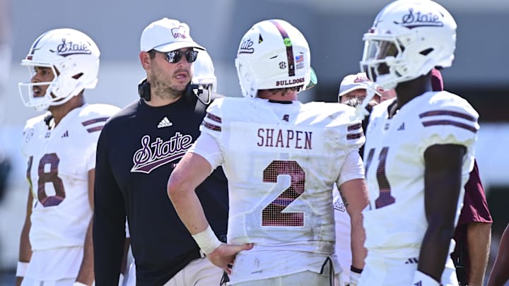 Sep 21, 2024; Starkville, Mississippi, USA; Mississippi State Bulldogs head coach Jeff Lebby speaks with quarterback Blake Shapen (2) during the fourth quarter against the Florida Gators at Davis Wade Stadium at Scott Field. Mandatory Credit: Matt Bush-Imagn Images