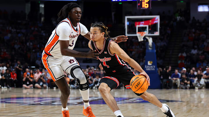 Nov 16, 2025; Birmingham, Alabama, USA; Houston Cougars guard Kingston Flemings (4) dribbles against Auburn Tigers forward KeShawn Murphy (3) during the first half at Legacy Arena at BJCC. Mandatory Credit: David Leong-Imagn Images Nov 16, 2025; Birmingham, Alabama, USA; Houston Cougars guard Kingston Flemings (4) dribbles against Auburn Tigers forward KeShawn Murphy (3) during the first half at Legacy Arena at BJCC. Mandatory Credit: David Leong-Imagn Images