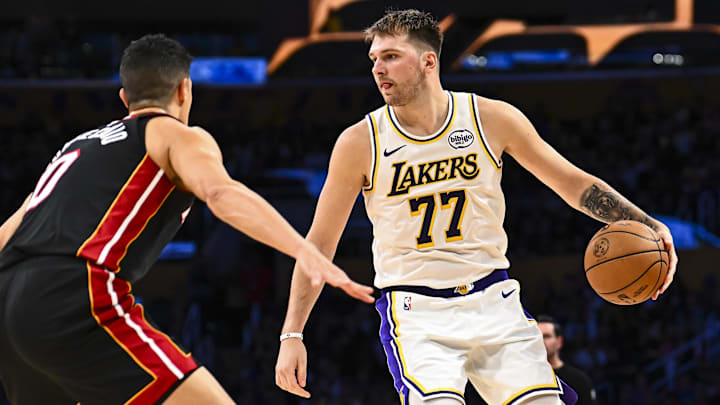 Nov 2, 2025; Los Angeles, California, USA; Los Angeles Lakers guard Luka Doncic (77) looks to pass against Miami Heat forward Simone Fontecchio (0) during the second half at Crypto.com Arena. Mandatory Credit: Jonathan Hui-Imagn Images Nov 2, 2025; Los Angeles, California, USA; Los Angeles Lakers guard Luka Doncic (77) looks to pass against Miami Heat forward Simone Fontecchio (0) during the second half at Crypto.com Arena. Mandatory Credit: Jonathan Hui-Imagn Images