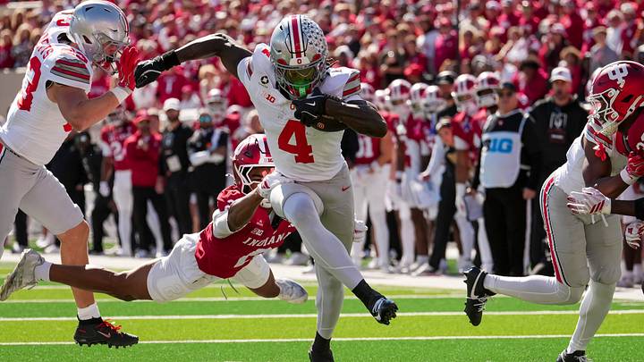 Ohio State wide receiver Jeremiah Smith runs past Indiana defensive back Byron Baldwin Jr.