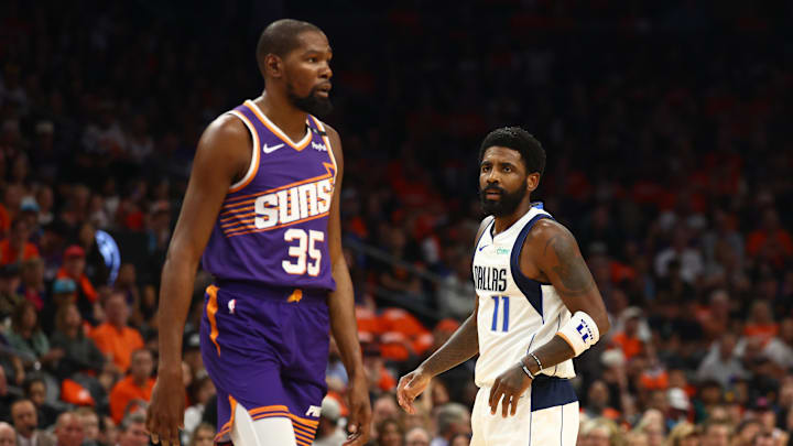 Oct 26, 2024; Phoenix, Arizona, USA; Dallas Mavericks guard Kyrie Irving (11) against Phoenix Suns forward Kevin Durant (35) at Footprint Center. Mandatory Credit: Mark J. Rebilas-Imagn Images