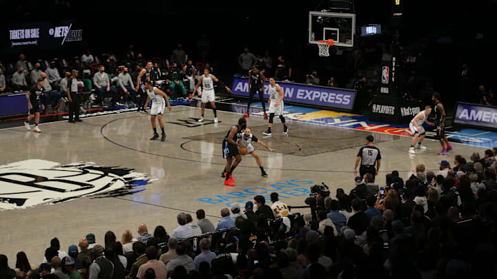 Jun 1, 2021; Brooklyn, New York, USA; General view as Brooklyn Nets shooting guard James Harden (13) handles the ball against Boston Celtics shooting guard Evan Fournier (94) during the first quarter of game five of the first round of the 2021 NBA Playoffs at Barclays Center. Mandatory Credit: Brad Penner-Imagn Images