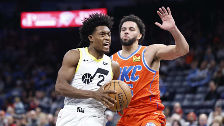 Dec 3, 2024; Oklahoma City, Oklahoma, USA; Utah Jazz guard Collin Sexton (2) drives to the basket beside Oklahoma City Thunder guard Ajay Mitchell (25) during the second half of an NBA Cup game at Paycom Center. Mandatory Credit: Alonzo Adams-Imagn Images