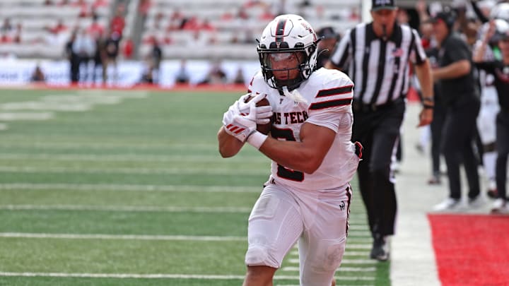 Sep 20, 2025; Salt Lake City, Utah, USA; Texas Tech Red Raiders running back Cameron Dickey (8) runs for a touchdown against the Utah Utes during the fourth quarter at Rice-Eccles Stadium. Mandatory Credit: Rob Gray-Imagn Images