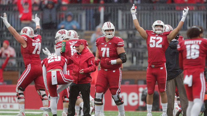 Wisconsin offensive lineman Riley Mahlman (71) and linebacker Kaden Johnson (52) celebrate after a replay review confirms a Badgers touchdown against Maryland on Saturday, Nov. 5, 2022, at Camp Randall Stadium in Madison.