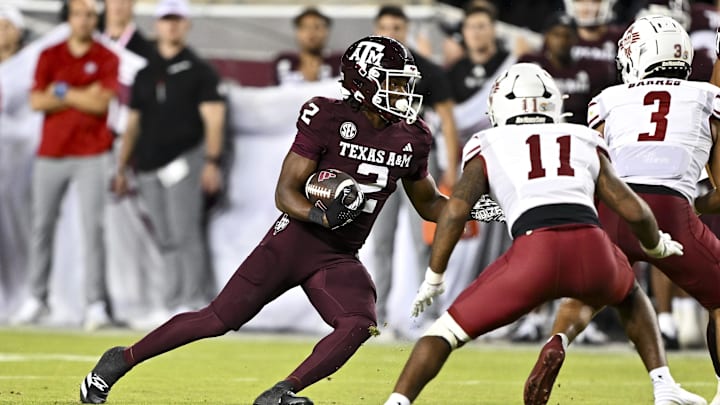 Nov 16, 2024; College Station, Texas, USA; Texas A&M Aggies wide receiver Terry Bussey (2) runs the ball during the fourth quarter against the New Mexico State Aggies at Kyle Field. Mandatory Credit: Maria Lysaker-Imagn Images 