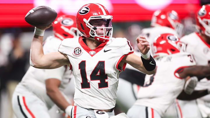 Dec 6, 2025; Atlanta, GA, USA; Georgia Bulldogs quarterback Gunner Stockton (14) throws a pass during the fourth quarter against the Alabama Crimson Tide during the 2025 SEC Championship game at Mercedes-Benz Stadium. Mandatory Credit: Brett Davis-Imagn Images