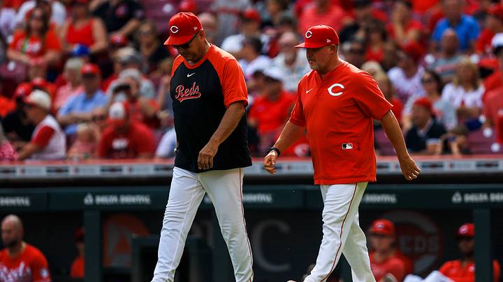 Sep 25, 2025; Cincinnati, Ohio, USA; Cincinnati Reds manager Terry Francona (77) and pitching coach Derek Johnson (36) walk onto the field during a pitching change in the seventh inning against the Pittsburgh Pirates at Great American Ball Park. Mandatory Credit: Katie Stratman-Imagn Images