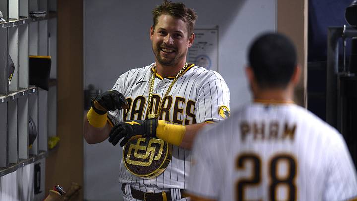 San Diego Padres right fielder Brian O'Grady (left) smiles in the dugout after hitting a two-run home run against the Chicago Cubs during the third inning at Petco Park on June 7, 2021.