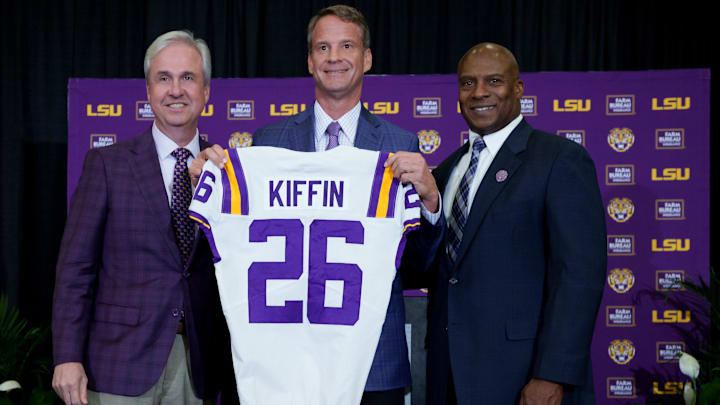 Dec 1, 2025; Baton Rouge, LA, USA; LSU president Wade Rousse, left, LSU new head coach Lane Kiffin and LSU athletic director Verge Ausberry stand together at South Stadium Club at Tiger Stadium. Mandatory Credit: Matthew Hinton-Imagn Images