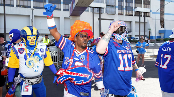 Apr 28, 2022; Las Vegas, NV, USA; Buffalo Bills fans cheer as a Los Angeles Rams fan watches while walking on the street before the first round of the 2022 NFL Draft.
