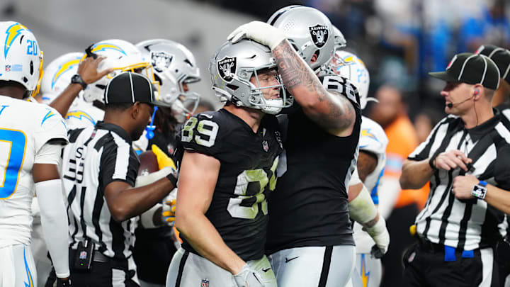 Jan 5, 2025; Paradise, Nevada, USA; Las Vegas Raiders center Andre James (68) consoles Las Vegas Raiders tight end Brock Bowers (89) after a missed reception against the Los Angeles Chargers during the fourth quarter at Allegiant Stadium. Mandatory Credit: Stephen R. Sylvanie-Imagn Images