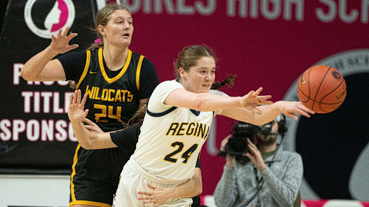 Iowa City Regina's Addie McLaughlin passes the ball during the IGHSAU state basketball tournament at Wells Fargo Arena on Wednesday, March 5, 2025, in Des Moines.