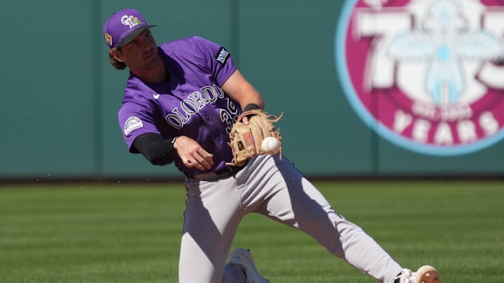 Mar 6, 2026; Mesa, Arizona, USA; Colorado Rockies shortstop Chad Stevens (39) makes the play against the Athletics in the second inning at Hohokam Stadium. Mandatory Credit: Rick Scuteri-Imagn Images