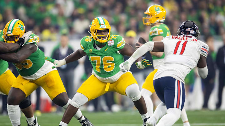 Jan 1, 2024; Glendale, AZ, USA; Oregon Ducks offensive lineman Josh Conerly Jr. (76) against the Liberty Flames during the 2024 Fiesta Bowl at State Farm Stadium. Mandatory Credit: Mark J. Rebilas-Imagn Images