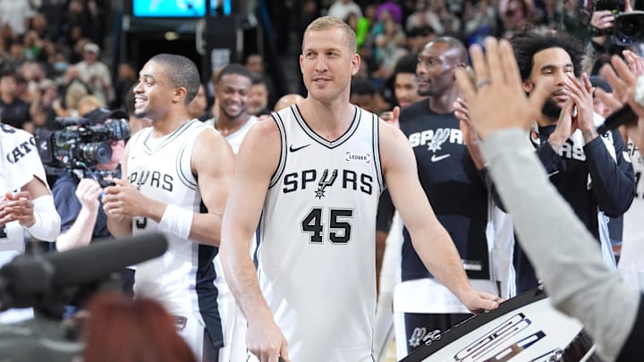 Mar 10, 2026; San Antonio, Texas, USA; San Antonio Spurs forward Mason Plumlee (45) beats a large drum at center court after defeating the Boston Celtics at Frost Bank Center. Mandatory Credit: Daniel Dunn-Imagn Images