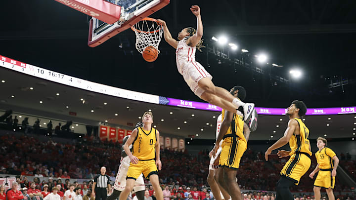 Nov 12, 2025; Houston, Texas, USA; Houston Cougars guard Kingston Flemings (4) dunks the ball during the first half against the Oakland Golden Grizzlies at Fertitta Center. 