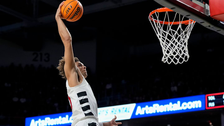 Cincinnati Bearcats guard Dan Skillings Jr. (0) leaps for a break away dunk in the first half of the NCAA mens basketball game between the Cincinnati Bearcats and the Arkansas-Pine Bluff Golden Lions at Fifth Third Arena on the University of Cincinnati campus on Monday, Nov. 4, 2024. The Bearcats led 55-32 at halftime. Cincinnati Bearcats guard Dan Skillings Jr. (0) leaps for a break away dunk in the first half of the NCAA mens basketball game between the Cincinnati Bearcats and the Arkansas-Pine Bluff Golden Lions at Fifth Third Arena on the University of Cincinnati campus on Monday, Nov. 4, 2024. The Bearcats led 55-32 at halftime.