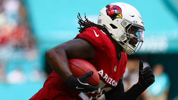 Oct 27, 2024; Miami Gardens, Florida, USA; Arizona Cardinals running back DeeJay Dallas (20) runs with the football against the Miami Dolphins during the third quarter at Hard Rock Stadium. Mandatory Credit: Sam Navarro-Imagn Images Oct 27, 2024; Miami Gardens, Florida, USA; Arizona Cardinals running back DeeJay Dallas (20) runs with the football against the Miami Dolphins during the third quarter at Hard Rock Stadium. Mandatory Credit: Sam Navarro-Imagn Images