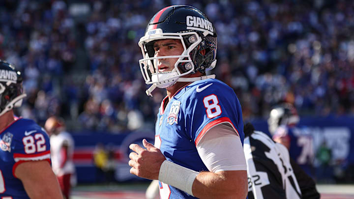 Nov 3, 2024; East Rutherford, New Jersey, USA; New York Giants quarterback Daniel Jones (8) runs of fetch field after throwing a touchdown pass during the first half against the Washington Commanders at MetLife Stadium. Mandatory Credit: Vincent Carchietta-Imagn Images