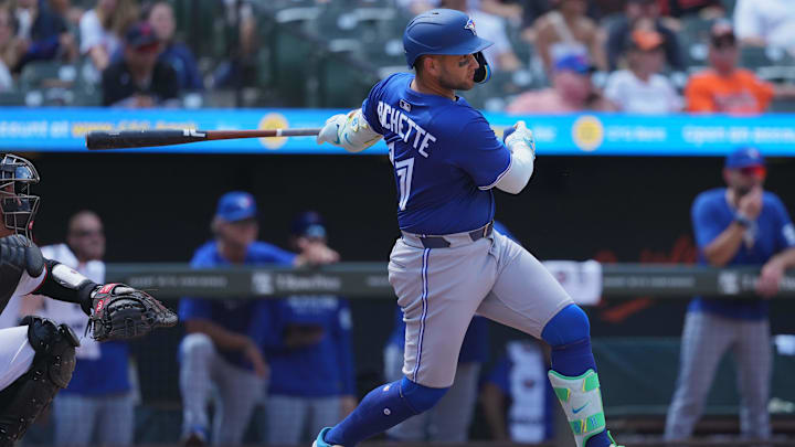 Jul 30, 2025; Baltimore, Maryland, USA; Toronto Blue Jays shortstop Bo Bichette (11) doubles to drive in two runs during the seventh inning against the Baltimore Oriolesat Oriole Park at Camden Yards. Mandatory Credit: Mitch Stringer-Imagn Images