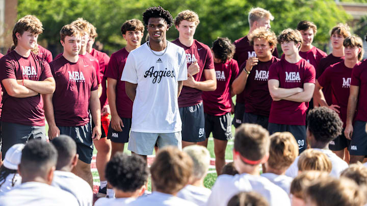 Former MBA quarterback and current Texas A&M starter Marcel Reed speaks at the start of a kids’ football camp held at MBA Saturday, July 12, 2025.
