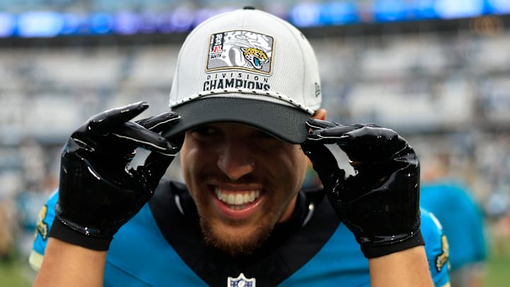 Jacksonville Jaguars wide receiver Parker Washington (11) puts on an AFC South Champions hat after the game of an NFL football matchup at EverBank Stadium, Sunday, Jan. 4, 2026, in Jacksonville, Fla. The Jaguars defeated the Titans 41-7, capturing the AFC North title. [Corey Perrine/Florida Times-Union]