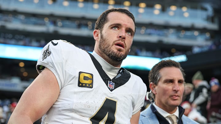 Dec 8, 2024; East Rutherford, New Jersey, USA; New Orleans Saints quarterback Derek Carr (4) walks off the field after field after an injury during the fourth quarter at MetLife Stadium. Mandatory Credit: Vincent Carchietta-Imagn Images